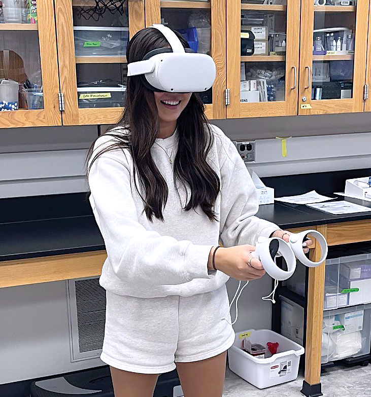 Female student wearing a VR headset